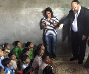 A class of children supported by The Gabriel Project listen to the Chief Rabbi as he teaches them English