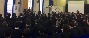 William Ellis Academy students listen as the Chief Rabbi urges them to preserve the memory of the Holocaust