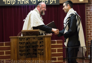 Rabbi Daniel Sturgess shakes hands with the Chief Rabbi upon taking the helm of St Albans